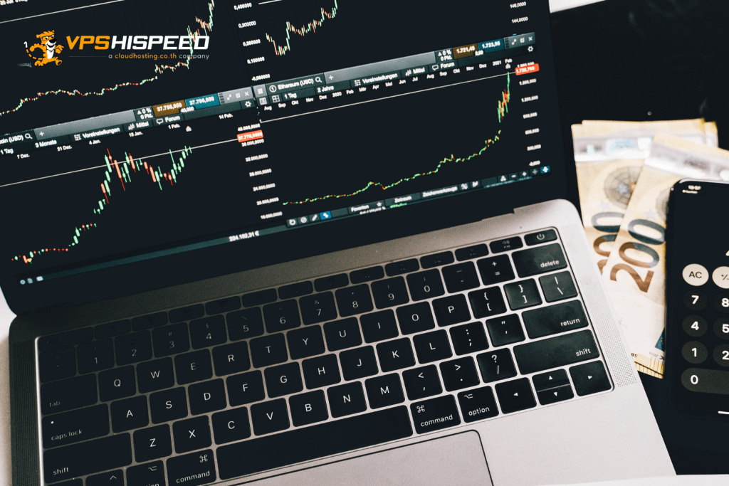 Laptop displaying forex trading charts with mobile trading device, illustrating when to use a Forex VPS for continuous EA trading